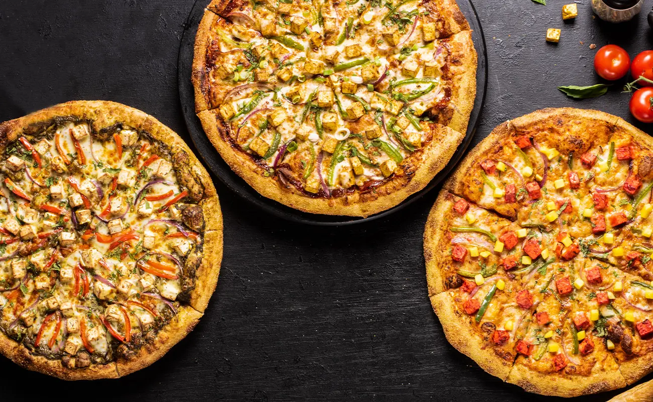 Explore Pizzawala’s delicious Paneer Pizza: fusion flavors like Tikka, Achari, Butter, and more, delivered to you.