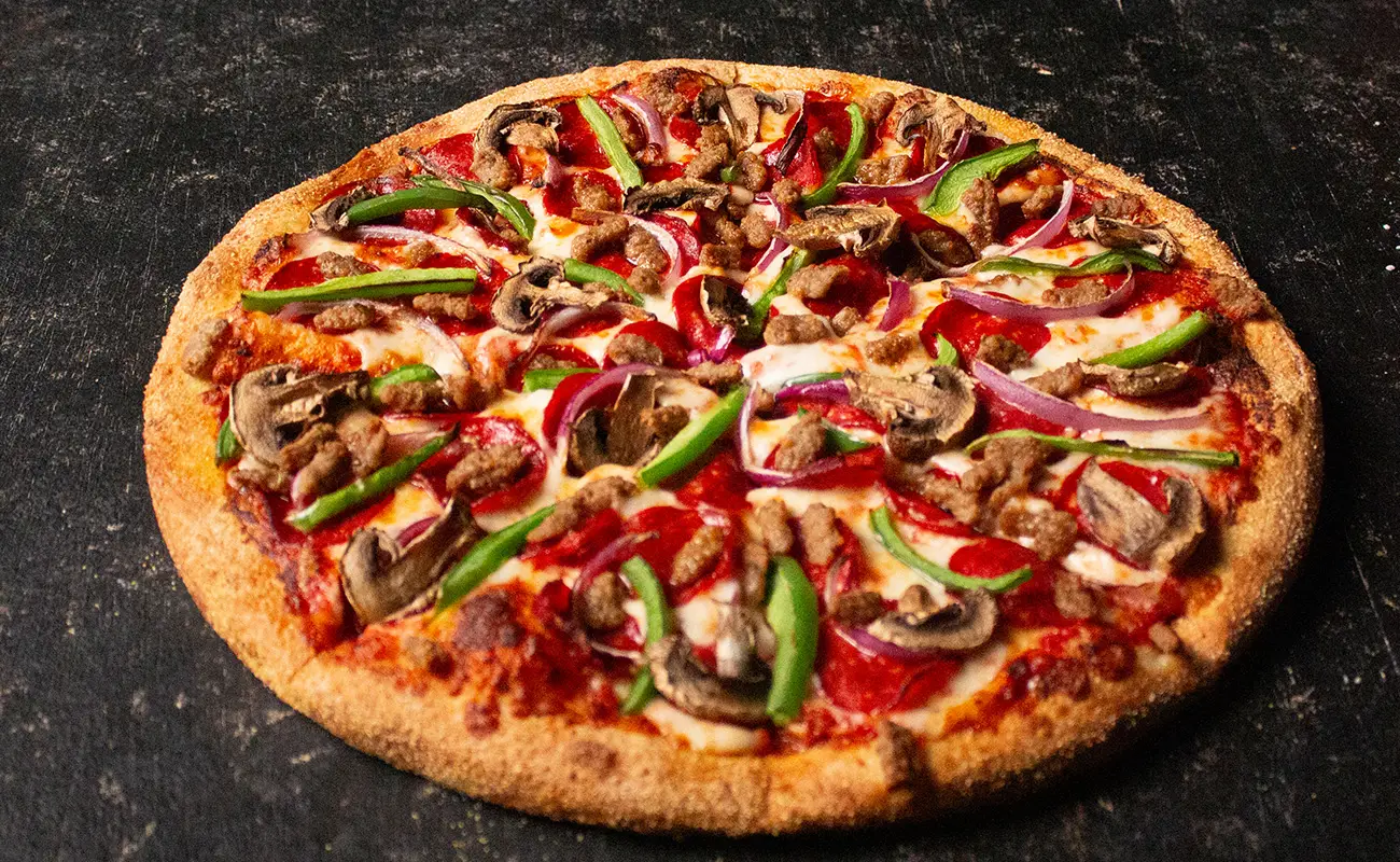 The Deluxe Works pizza